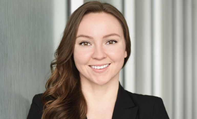 Photo of Vivian Wilson, wearing suit and smiling