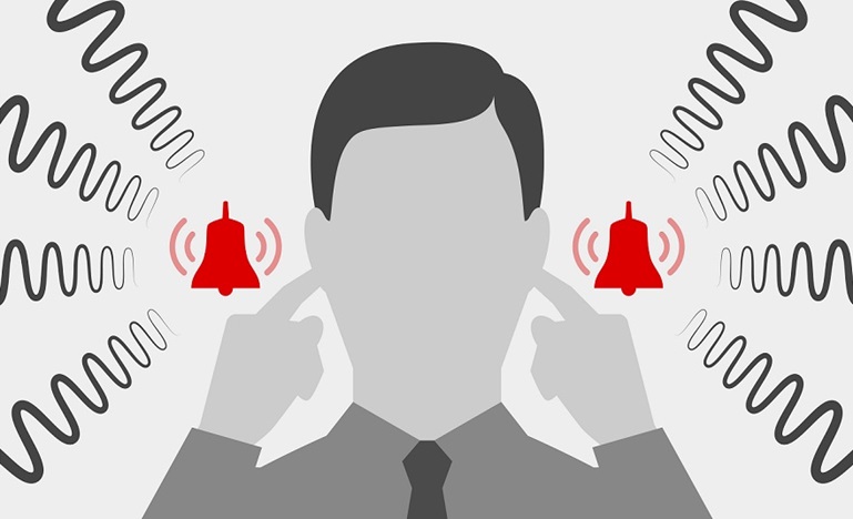 man with fingers in ears blocking out noise