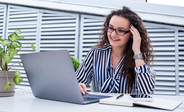 Woman looking at her laptop